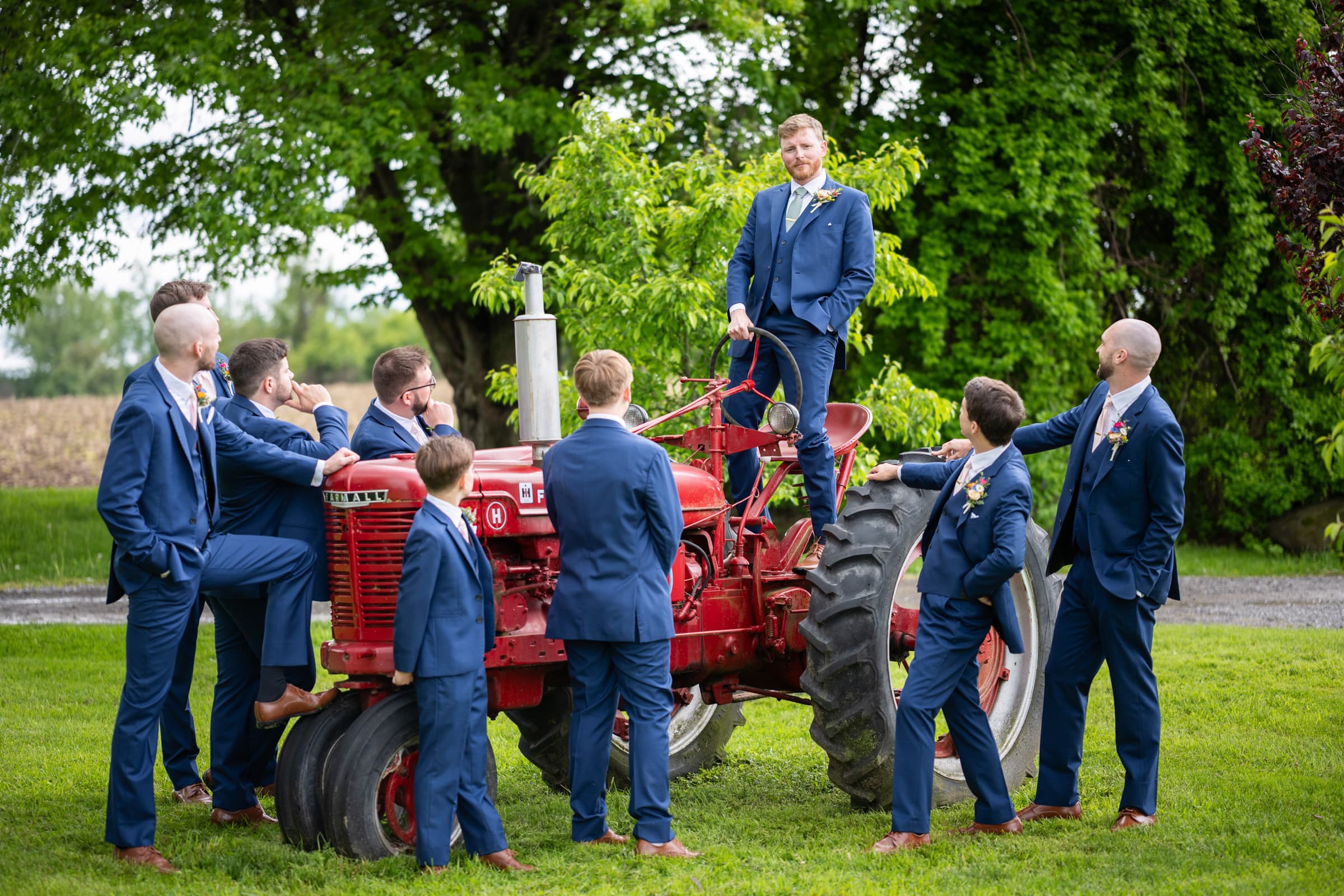 Wedding Party with tractor at Cobblestone Wedding Barn in Scottsville, NY | Rochester Wedding Photography